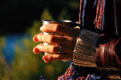 Close-up of hand holding wine glass