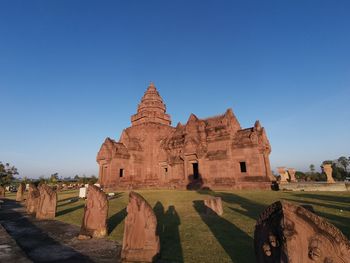 Old temple against clear blue sky