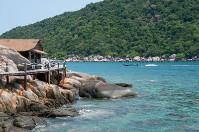 Scenic view of sea against mountain