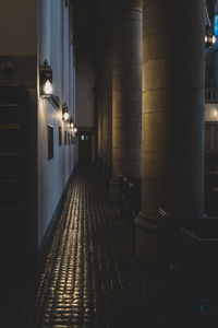 Illuminated corridor with gothic columns in shallow depth of field 