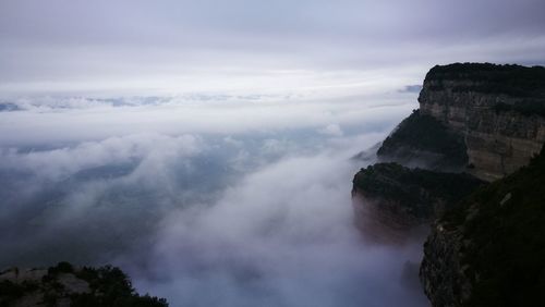 Scenic view of waterfall against sky