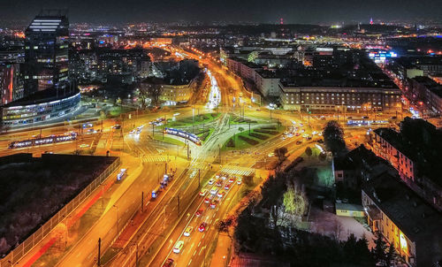 High angle view of illuminated buildings in city at night