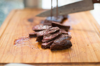 Close-up of meat on cutting board