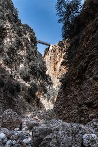 Low angle view of rock formation against sky