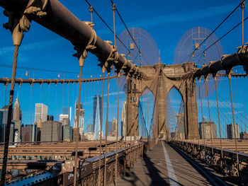 Suspension bridge against blue sky