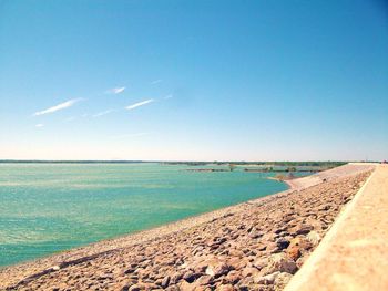 Scenic view of sea against clear blue sky