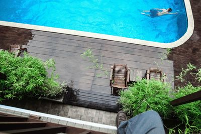High angle view of wooden deck and swimming pool