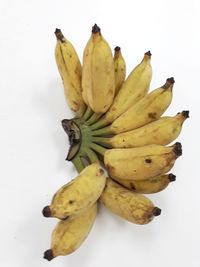 Close-up of bananas against white background