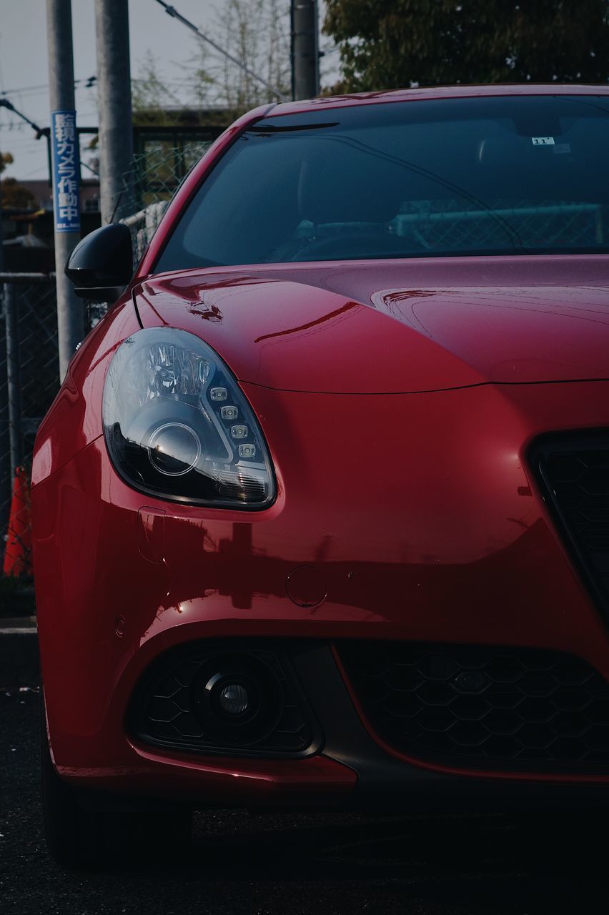 CLOSE-UP OF RED CAR