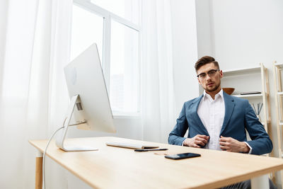 Portrait of businessman working at office