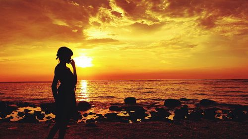 Scenic view of sea at sunset