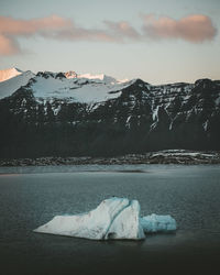 Scenic view of snowcapped mountains against sky during winter