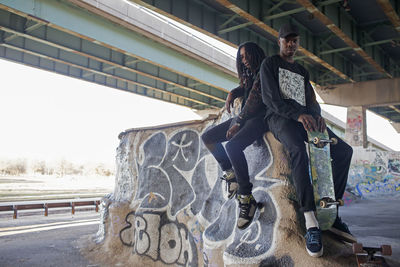 Two young men at a skateboard park.