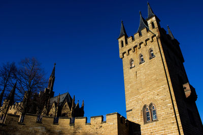 Low angle view of building against blue sky