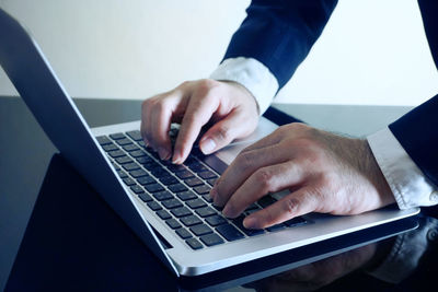 Low angle view of man using mobile phone