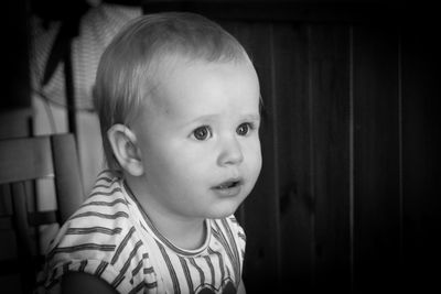 Close-up portrait of cute boy at home