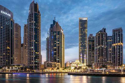 Illuminated buildings in city at night