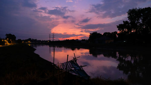 Scenic view of lake against sky during sunset