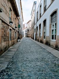 Alley amidst buildings in city