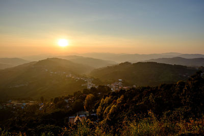 Scenic view of mountains against sky during sunset