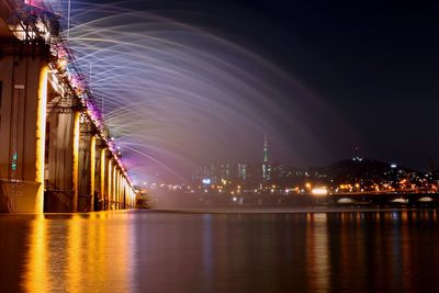 Illuminated ferris wheel at night