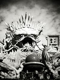 Low angle view of statue against sky