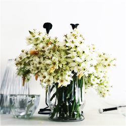 Close-up of white flowers in vase on table