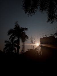 Low angle view of silhouette trees against sky during sunset