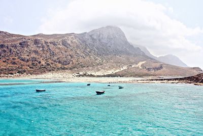 Scenic view of sea against cloudy sky