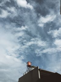 Low angle view of water tower against sky