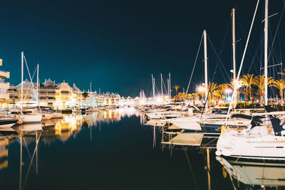 Boats moored at harbor