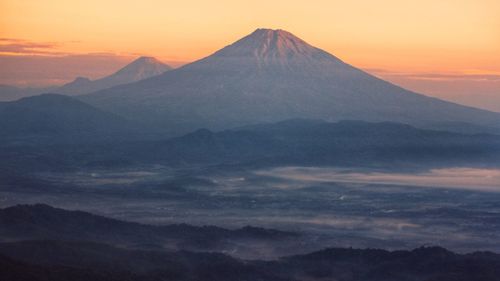 Scenic view of mountains against sky during sunset