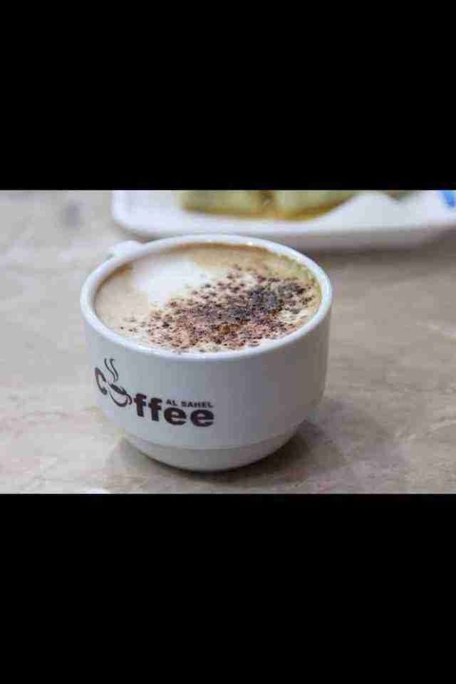 drink, food and drink, refreshment, coffee cup, indoors, table, coffee - drink, freshness, saucer, still life, coffee, frothy drink, close-up, cup, beverage, cappuccino, high angle view, spoon, drinking glass, hot drink