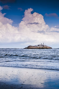 Scenic view of sea against cloudy sky