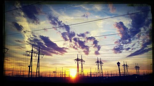 Low angle view of cloudy sky at sunset