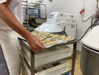 Low angle view of man working on cutting board