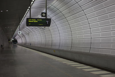 Text on wall at subway station