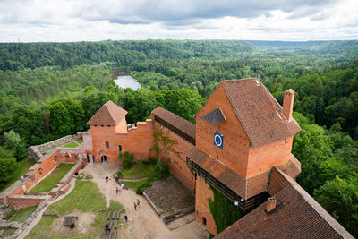 High angle view of houses and trees against sky