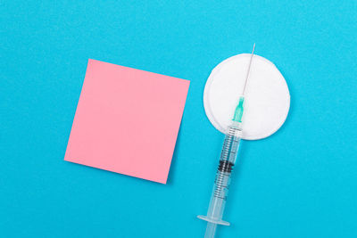 High angle view of clock on blue table