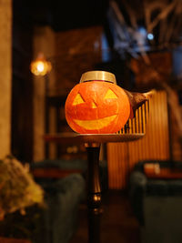 Close-up of illuminated lantern on table