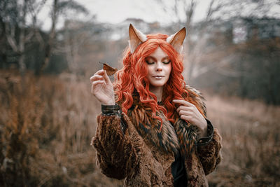 Portrait of young woman in winter