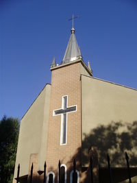 Low angle view of temple against clear blue sky