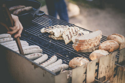 High angle view of meat on barbecue grill