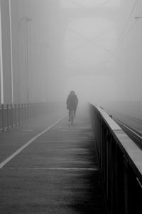 Full length of woman walking on road