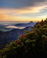 Scenic view of mountains against sky at sunset