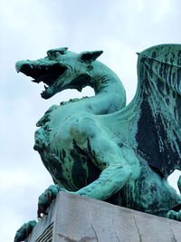 Low angle view of statue against sky