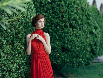 Portrait of a young woman standing outdoors