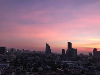 Buildings against sky during sunset