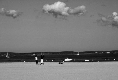 Man on beach against sky