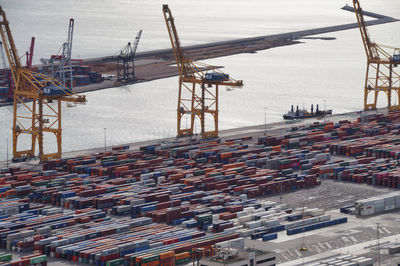 High angle view of cranes at harbor